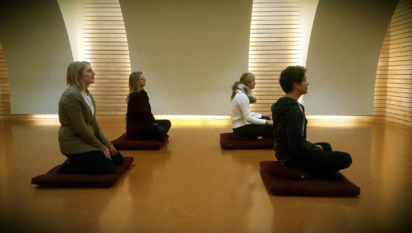 Photo of group meditating 